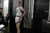 UConn center Donovan Clingan waits to be interviewed ahead of a Final Four college basketball game in the NCAA Tournament, Thursday, April 4, 2024, in Glendale, Ariz. UConn will face Alabama on Saturday. (AP Photo/Brynn Anderson )