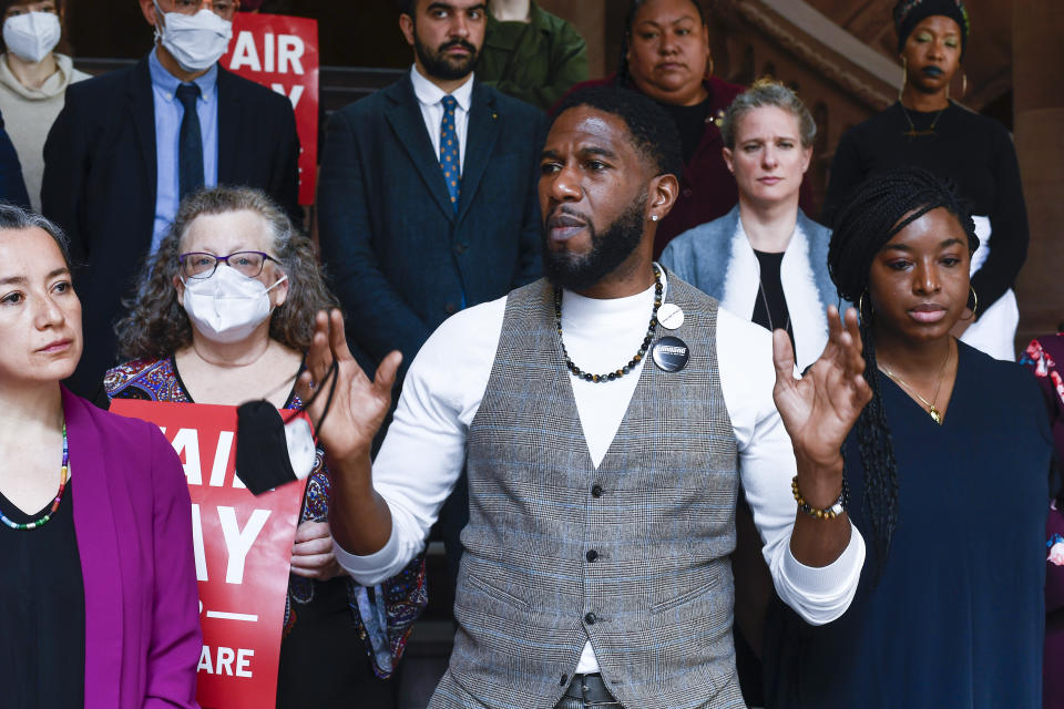 Jumaane Williams stands in a group of people.