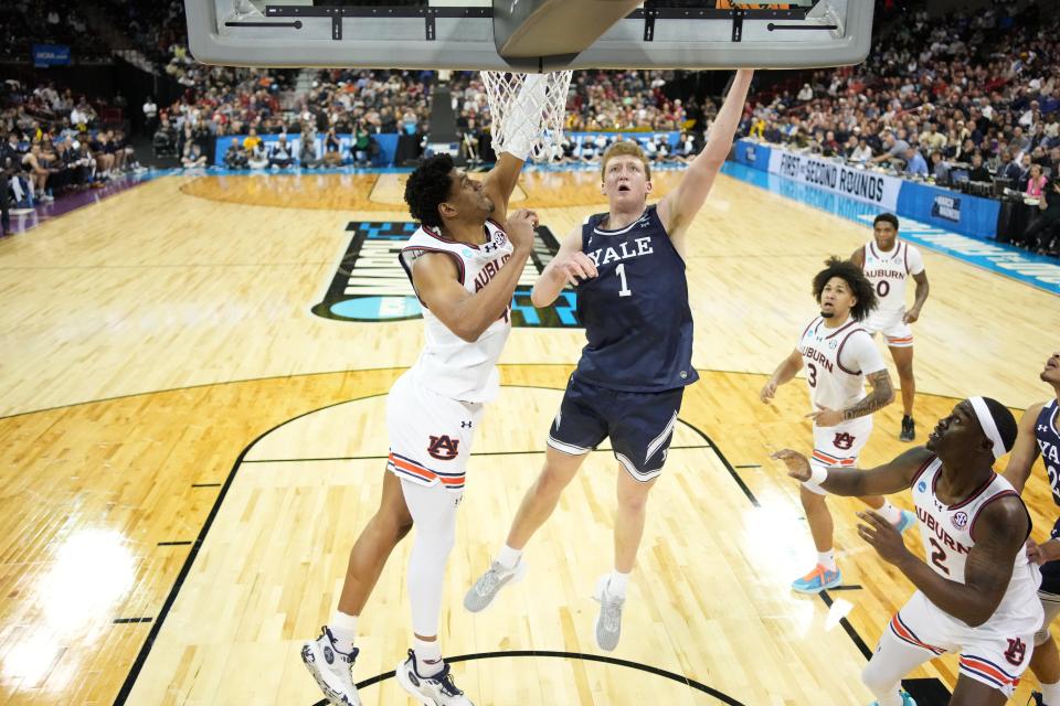 Mar 22, 2024; Spokane, WA, USA; Yale Bulldogs forward Danny Wolf (1) attempts a layup against the Auburn Tigers during the first half of a game in the first round of the 2024 NCAA Tournament at Spokane Veterans Memorial Arena. Mandatory Credit: Kirby Lee-USA TODAY Sports