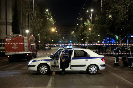 Greek police secure the area after a bomb blast in central Athens, Greece, April 19, 2017. REUTERS/Alkis Konstantinidis