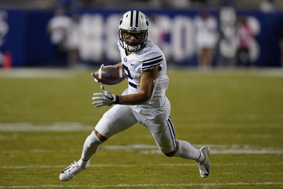 BYU wide receiver Neil Pau'u carries the ball against Western Kentucky during the first half of an NCAA college football game Saturday, Oct. 31, 2020, in Provo, Utah. (AP Photo/Rick Bowmer, Pool)