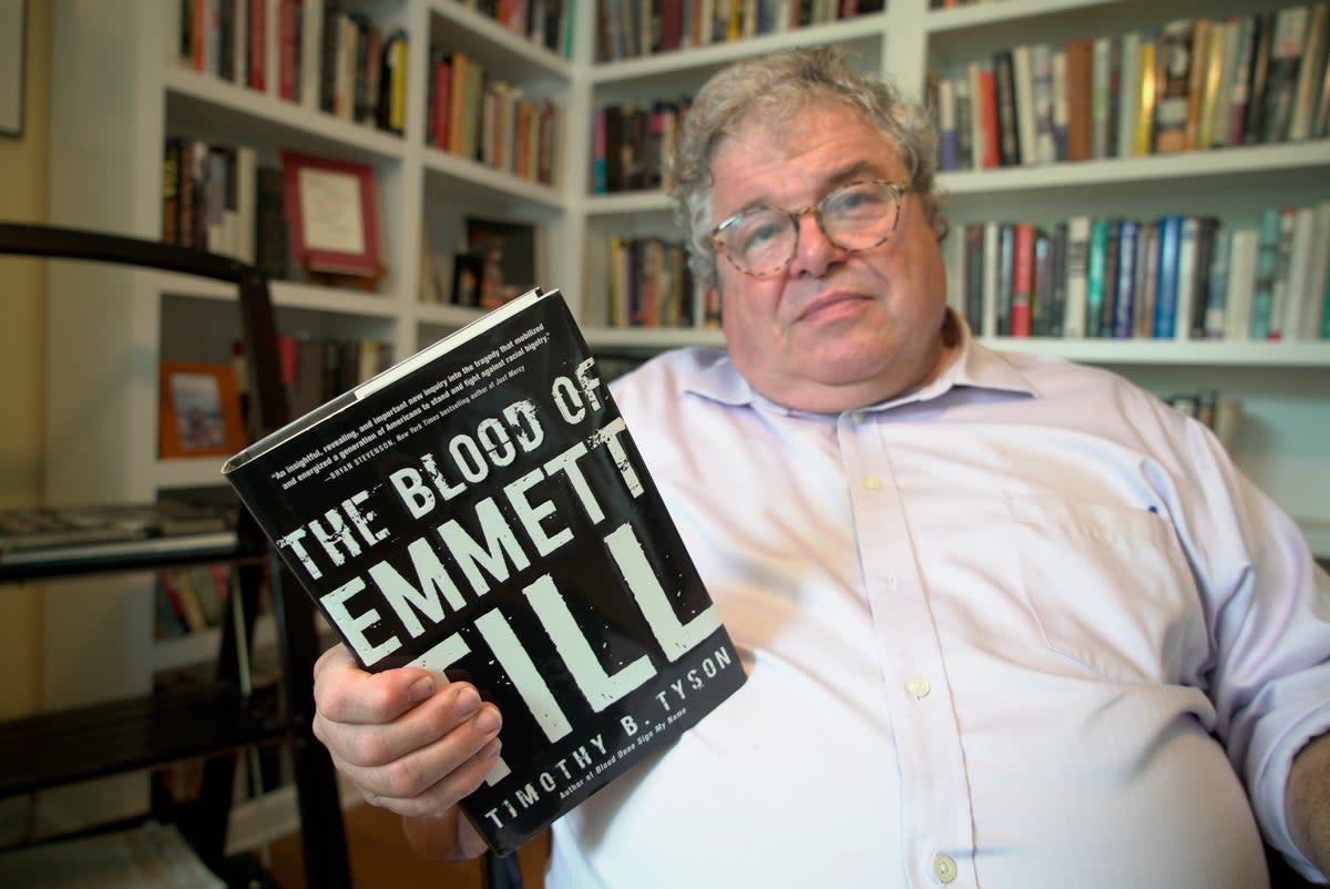 Author Timothy Tyson holds a copy of his book on the lynching of Emmett Till, in which (AP)