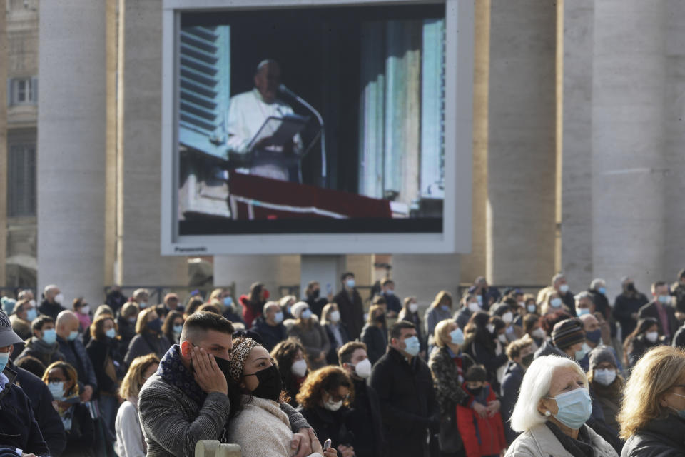 Faithful gather in St. Peter's Square on the occasion of the Angelus prayer at the Vatican, Sunday, Dec. 20, 2020. (AP Photo/Gregorio Borgia)