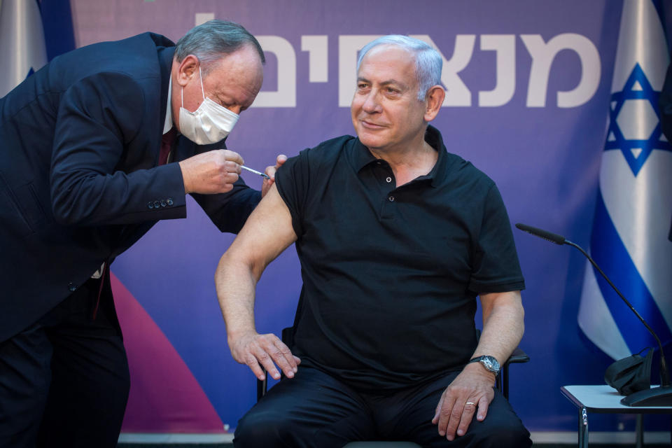 TOPSHOT - Israeli Prime Minister Minister Benjamin Netanyahu receives the second dose of the coronavirus disease (COVID-19) vaccine at Sheba Medical Center in Ramat Gan, near the coastal city of Tel Aviv, on January 9, 2021. (Photo by Miriam ALSTER / POOL / AFP) (Photo by MIRIAM ALSTER/POOL/AFP via Getty Images)