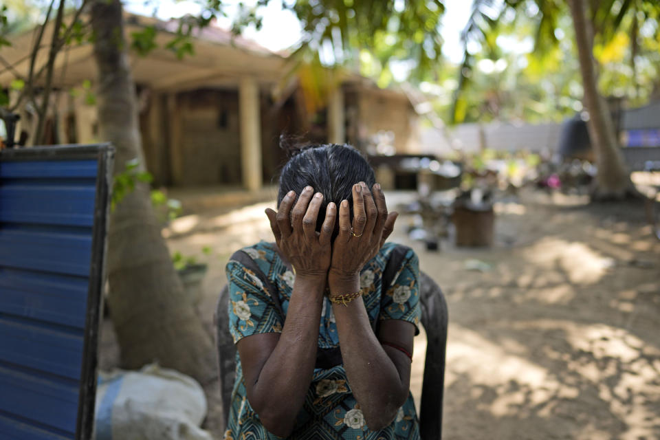 Rasalingam Thilakawathi cries for her missing daughter at her home in Mullaitivu, Sri Lanka, Tuesday, May 7, 2024. Thilakawathi, who lives in Moongilaaru village of Mullaitivu district, the theatre of the final battles in the civil war, says her daughter was recruited by the Tamil Tigers three years before she went missing. Sri Lanka's civil war, which pitted Sri Lankan government forces against Tamil Tiger separatists, ended 15 years ago but many people are still searching for children or other family members who are missing, some presumed dead. (AP Photo/Eranga Jayawardena)