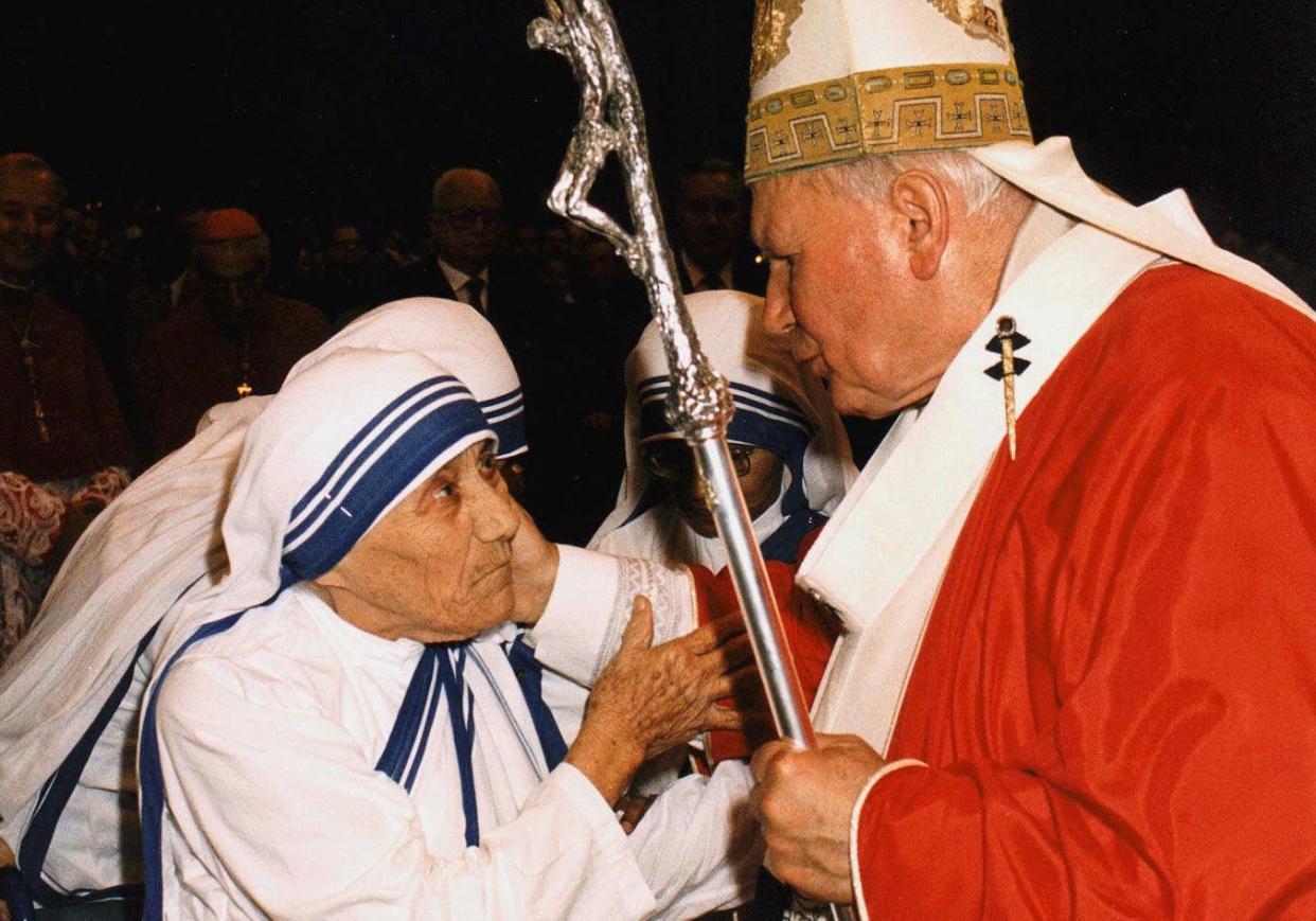 In this photo taken Sunday, June 29, 1997, Pope John Paul II greets Mother Teresa of Calcutta as they meet in St. Peter's Basilica at the Vatican. The documentary "Mother Teresa: No Greater Love," will be shown in theaters nationwide in October.