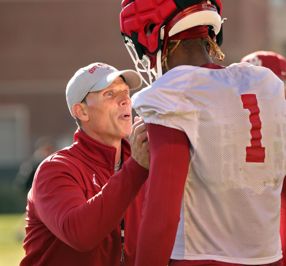 OU head coach Brent Venables, left, works with Dasan McCullough during a practice on March 21 outside Gaylord Family-Oklahoma Memorial Stadium in Norman.