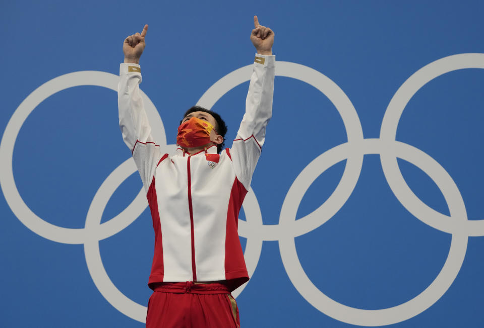 Xie Siyi of China reacts after winning gold medal in men's diving 3m springboard final at the Tokyo Aquatics Centre at the 2020 Summer Olympics, Tuesday, Aug. 3, 2021, in Tokyo, Japan. (AP Photo/Dmitri Lovetsky)