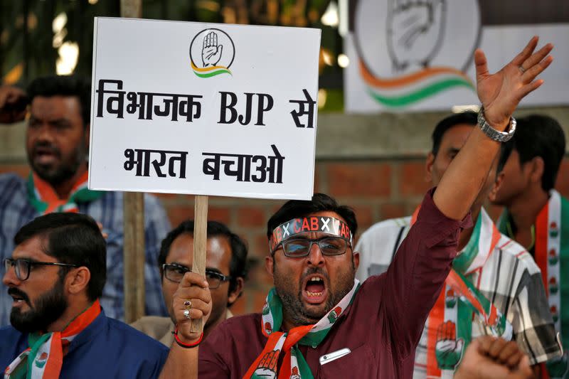 Supporters of India's main opposition Congress party shout slogans during a protest against the Citizenship Amendment Bill, in Ahmedabad