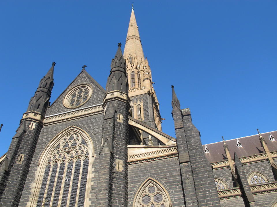FILE - This Sept. 9, 2018, file photo shows the facade of St. Patrick's Cathedral in Melbourne. Cardinal George Pell’s appeal against his convictions for child molestation was largely a question of who the jury should have believed, his accuser or a senior priest whose church role was likened to Pell’s bodyguard. Pell’s accuser was a 13-year-old choirboy when he alleged that he was abused by then-Melbourne Archbishop Pell at the city’s St. Patrick’s Cathedral in December 1996 and February 1997. (AP Photo/Rod McGuirk, File)