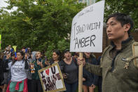 Dan Kim demonstrates in support of Amber Heard as supporters of actor Johnny Depp rally outside of Fairfax County Courthouse in Fairfax, Va., on Friday, May 27, 2022. A jury is scheduled to hear closing arguments in Johnny Depp's high-profile libel lawsuit against ex-wife Amber Heard.(AP Photo/Craig Hudson)