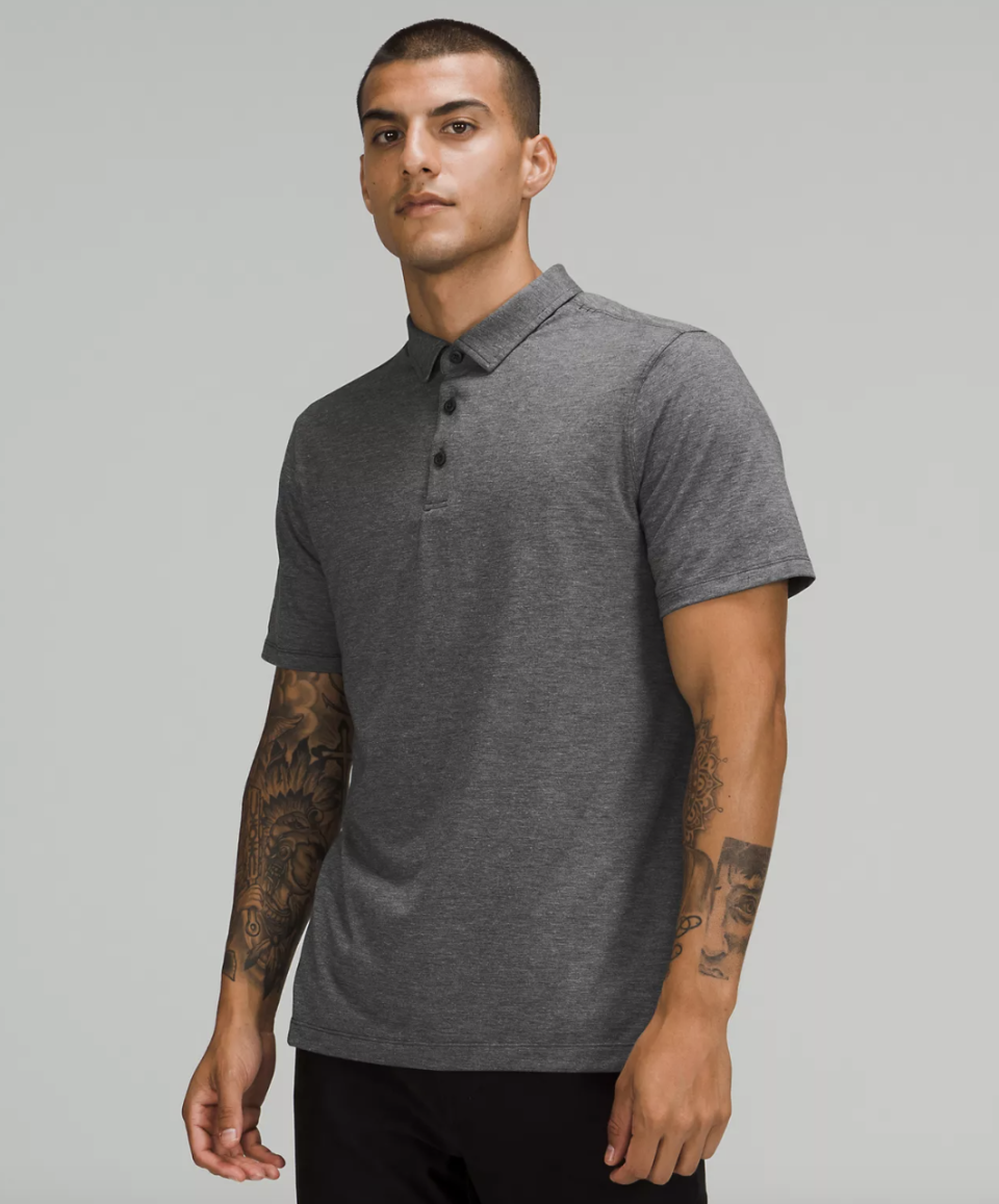 man wearing grey Evolution Short-Sleeve Polo Shirt (photo via lululemon)