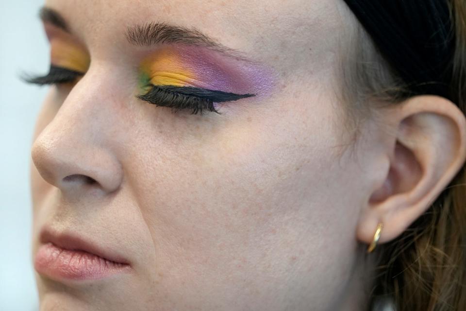 July 16, 2022; Columbus, Ohio, USA;  Logan Seals (she/her), 33, of Dayton Seals, gets a splash of color added to her eyes by makeup artist Lina Lelli of Groveport.Mandatory Credit: Barbara J. Perenic/Columbus Dispatch