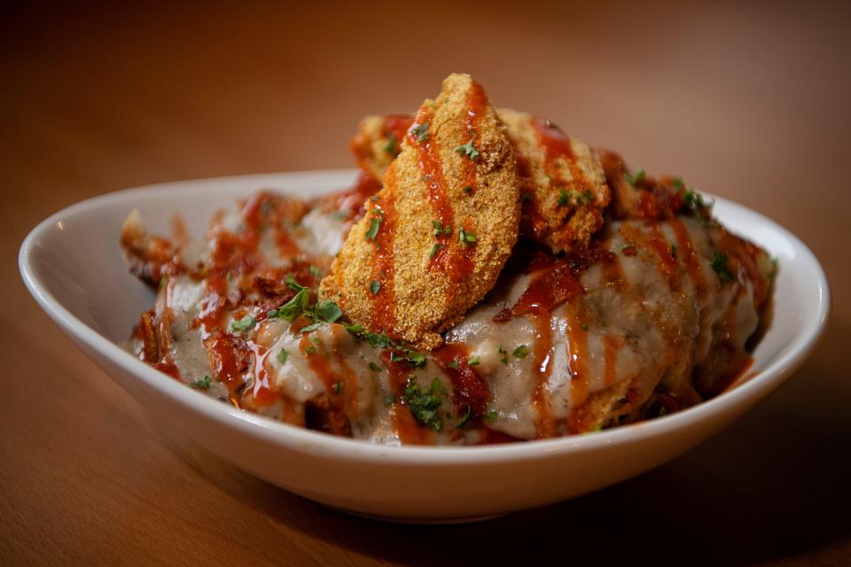 The Smoking’ Onion’s biscuits and gravy comes with oyster mushroom breakfast gravy, a fried green tomato and hot sauce.
