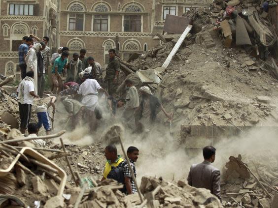 Yemenis search for survivors under the rubble of houses in the Unesco-listed heritage site in the old city of Yemeni capital Sana’a, in June 2015 following an overnight Saudi-led airstrike (Getty)