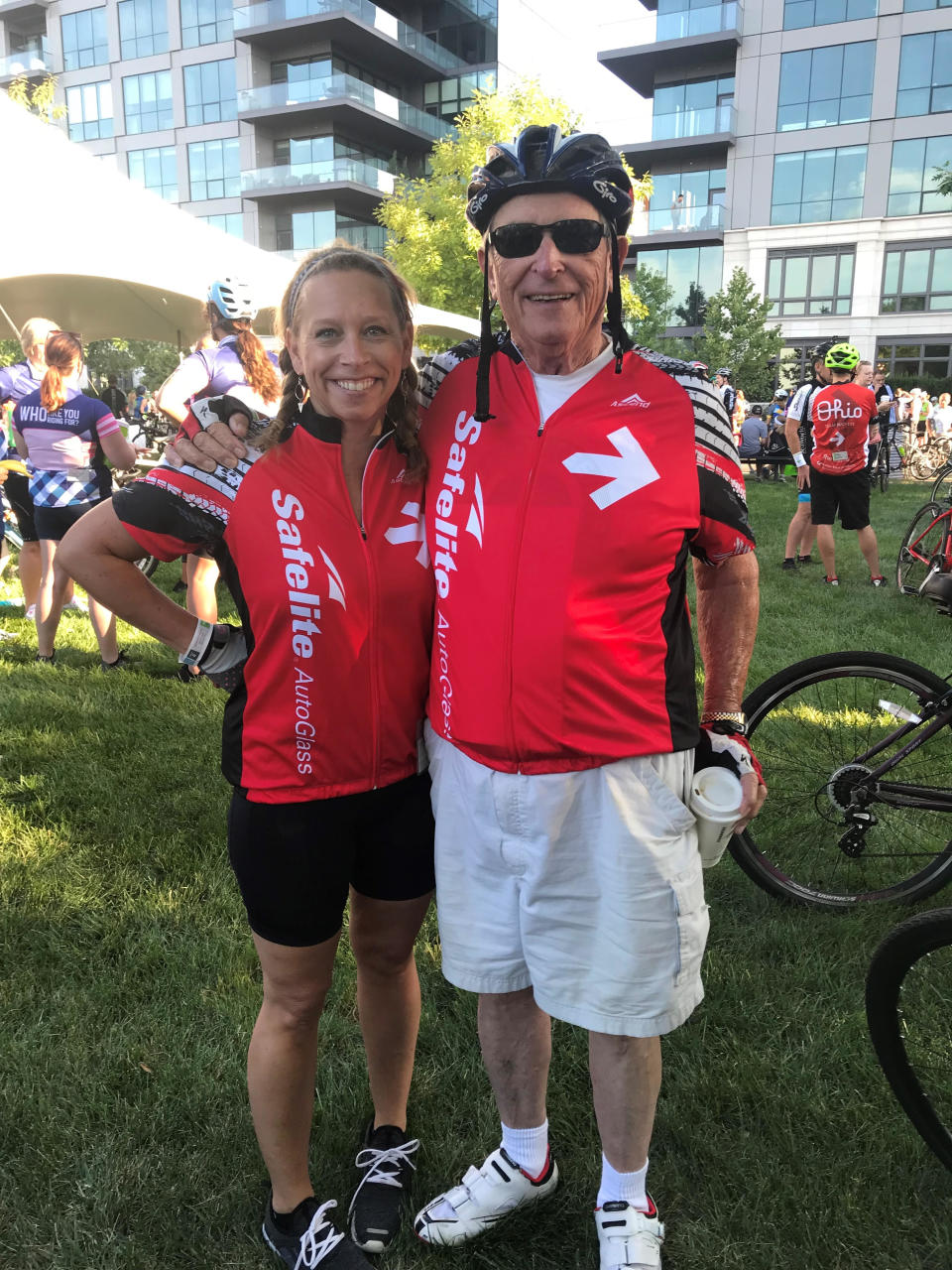 Elizabeth Howard, a lead volunteer for Pelotonia, poses with her father, Charles Cook, after riding in the 2019 event.