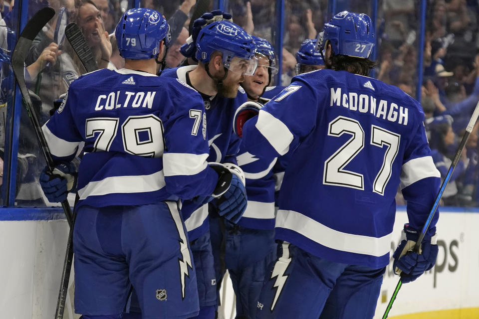 Tampa Bay Lightning defenseman Erik Cernak (81, center) celebrates his goal against the Florida Panthers with center Ross Colton (79) and defenseman Ryan McDonagh (27) during the second period in Game 3 of an NHL hockey second-round playoff series Sunday, May 22, 2022, in Tampa, Fla. (AP Photo/Chris O'Meara)