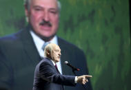 Belarusian President Alexander Lukashenko gestures as he addresses a women's forum in Minsk, Belarus, Thursday, Sept. 17, 2020. President Alexander Lukashenko's decision to close the borders with Poland and Lithuania underlines his repeated claim that the massive wave of protests is driven by the West and comes amid increasing criticism from the United States and the European Union. (TUT.by via AP)