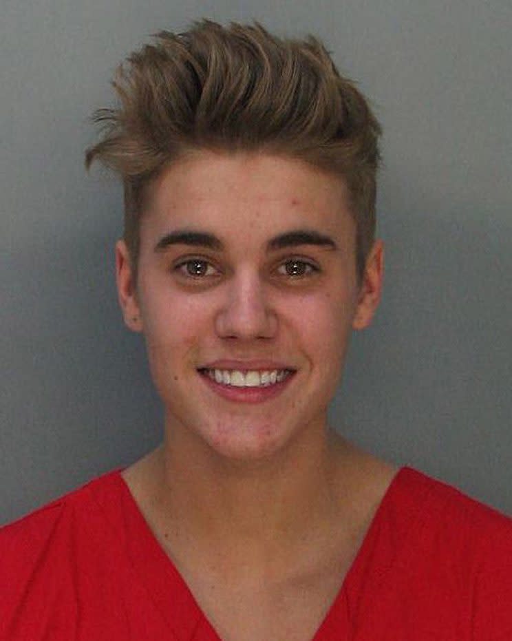 Justin Bieber says getting arrested isn't cool -- though he sure didn't look upset about it when it happened here in 2014. (Photo: Getty Images)