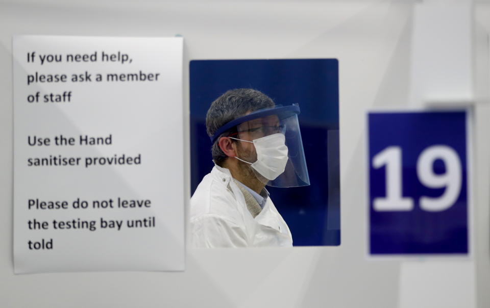 An employee attends testing of a lateral flow antigen test facility, amid the spread of the coronavirus disease (COVID-19), in St Andrews, Scotland, Britain, November 27, 2020. REUTERS/Russell Cheyne