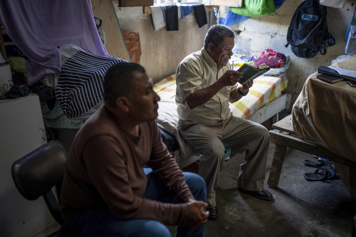 Nicaraguan exile Francisco Alvicio, right, a deacon of Nicaragua's Moravian Church, prays in his rented room alongside fellow exile and Miskito leader Salomon Martinez Ocampo in San Jose, Costa Rica, Sunday, Sept. 22, 2024. (AP Photo/Carlos Herrera)