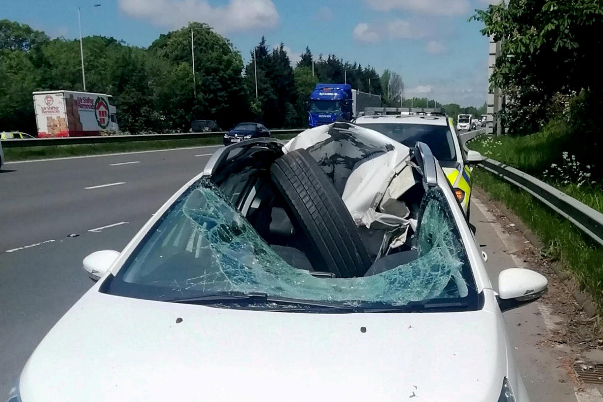 A driver has been called the "luckiest person in the world" after a tyre came off a lorry and crashed into his car on the M6 near Leyland. (SWNS)