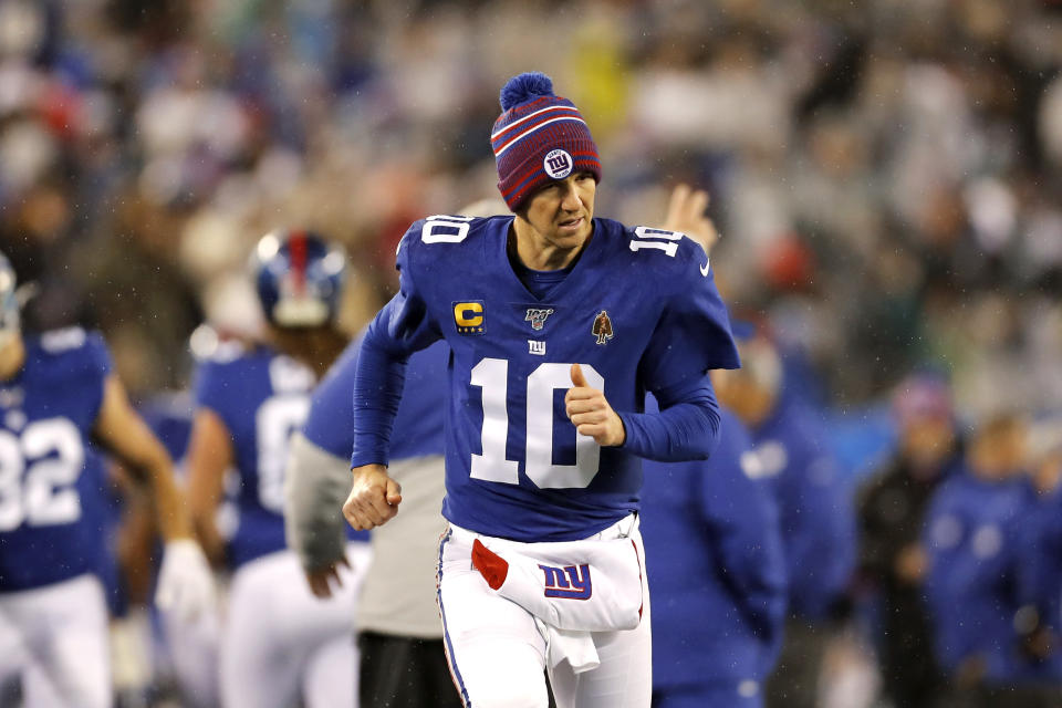 New York Giants quarterback Eli Manning (10) runs on the sideline in the second half of an NFL football game against Philadelphia Eagles on Sunday, Dec. 29, 2019, in East Rutherford, N.J. (AP Photo/Adam Hunger)
