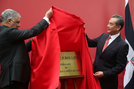 China's Foreign Minister Wang Yi and Dominican Republic's Chancellor Miguel Vargas unveil a plaque during the opening of a new Chinese Embassy in the Dominican Republic, in Santo Domingo, Dominican Republic, September 21, 2018. REUTERS/Ricardo Rojas