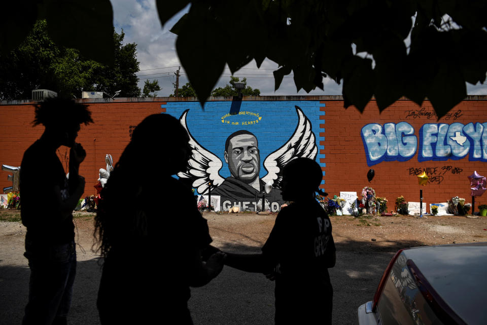 Mourners photograph a mural of George Floyd, whose death in Minneapolis police custody sparked nationwide protests against racial inequality, in Houston on June 8. (Photo: Callaghan O'Hare / reuters)