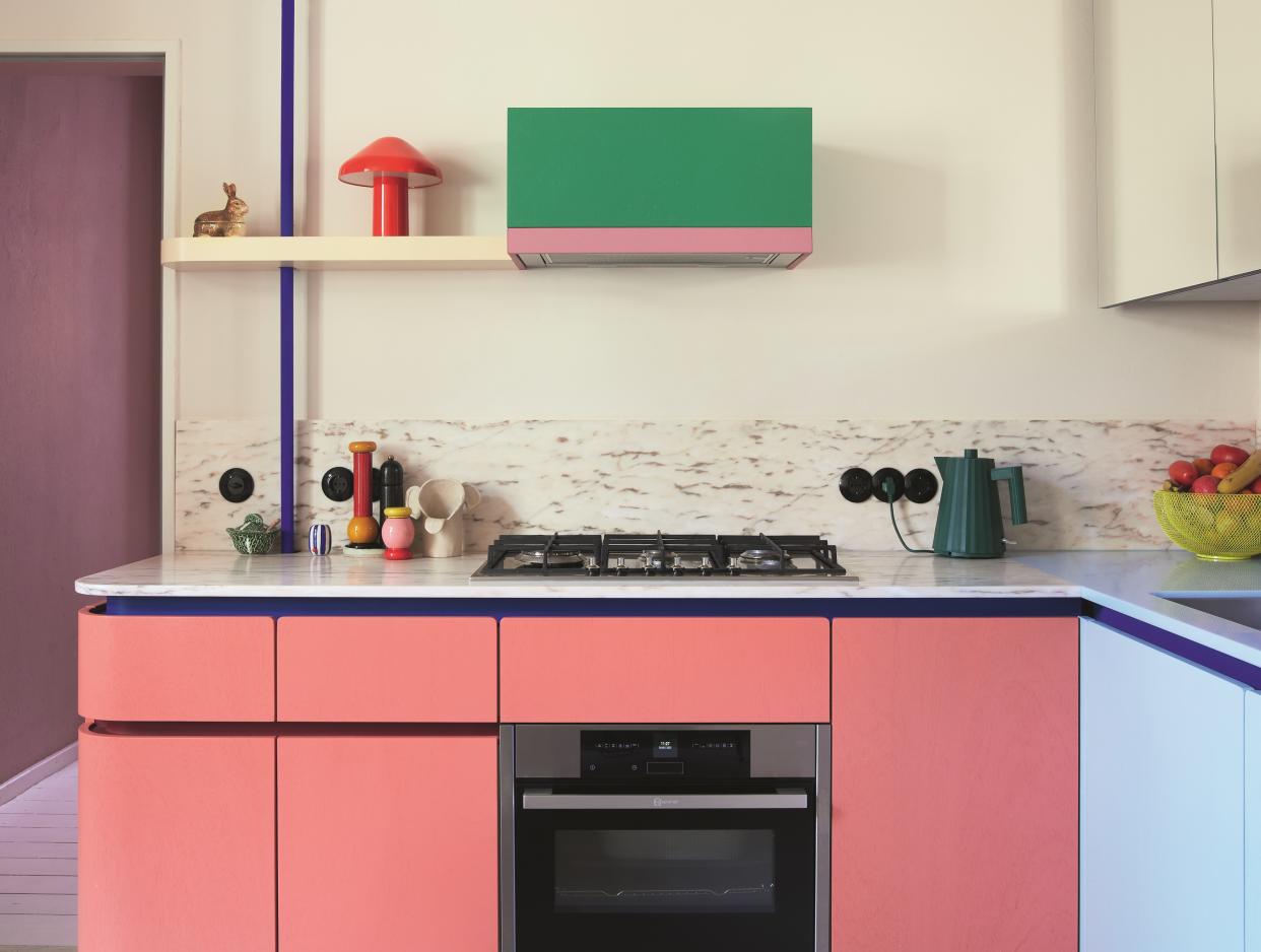  A neutral kitchen with pops of colorful paint. 