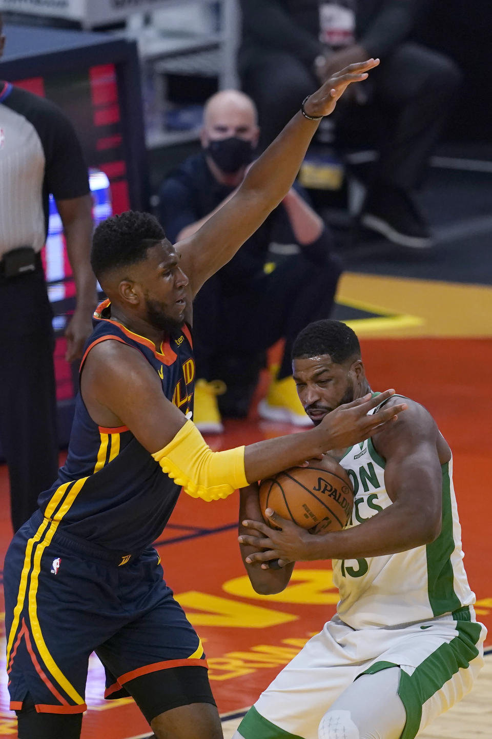 Boston Celtics forward Tristan Thompson, right, is defended by Golden State Warriors forward Kevon Looney during the first half of an NBA basketball game in San Francisco, Tuesday, Feb. 2, 2021. (AP Photo/Jeff Chiu)