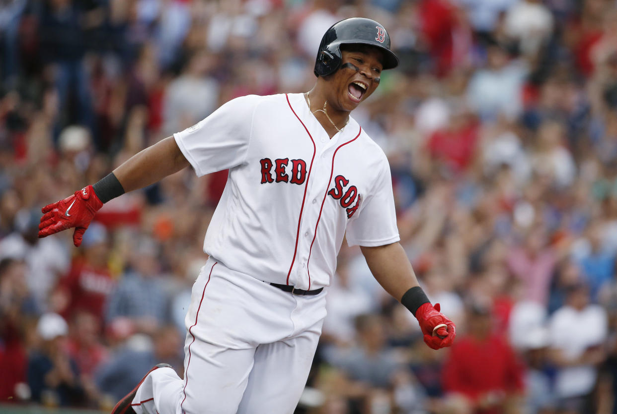 Rafael Devers is staying in Boston on a $331 million deal. (AP Photo/Michael Dwyer)