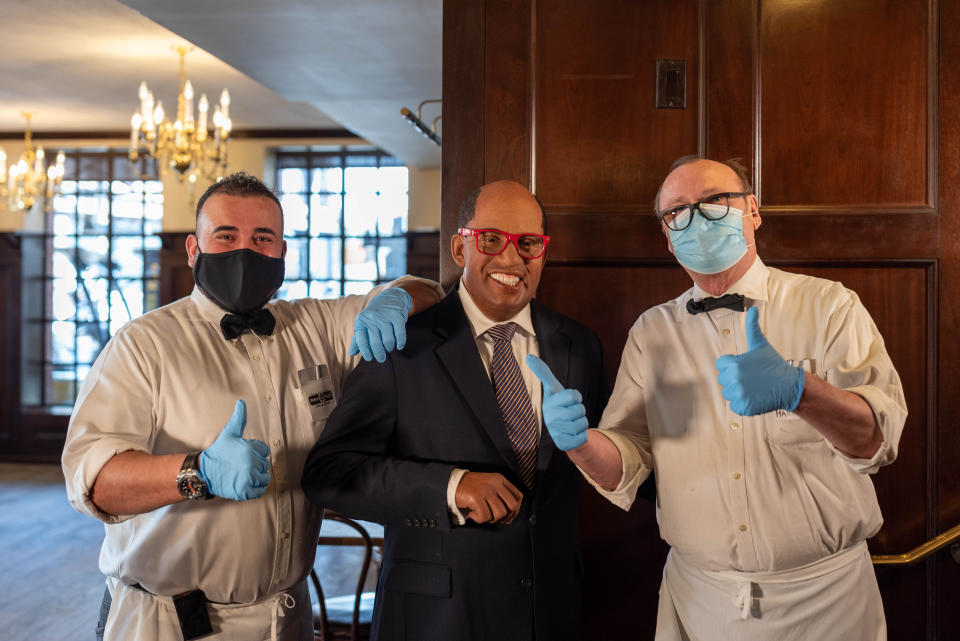 Two waiters get their photo taken with a wax figure of Al Roker at Peter Luger's Steakhouse in Brooklyn in New York City on March 2021. (Photo: Courtesy of Madame Tussauds)