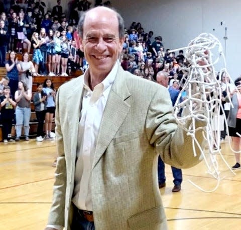 Madison Middle High teacher Rick Johnson is honored by students on his final day of school in an education career that spanned 35 years, both as a classroom instructor and as a coach. In an interesting circle-come-full moment, Johnson attended this same school facility as a student-athlete back when it housed Sooner High School.