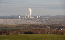 The Turow lignite coal mine and Turow power plant near the town of Bogatynia, Poland, Tuesday, Nov. 19, 2019. The Turow lignite coal mine in Poland has an impact on the environment and communities near the border of three neighboring countries, the Czech Republic, Germany and Poland. Plans to further expand the huge open pit mine have caused alarm among residents who fear things might get even worse. (AP Photo/Petr David Josek)