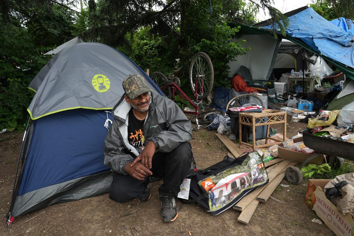 Dispatch photojournalist Fred Squillante'svphoto of Tony Holbrook at a homeless camp near the city of Columbus' Heer Park on June 6, 2022 was among pictures that led to Squillante winning two awards Sunday at the Ohio Associated Press Media Editors Awards in Columbus.