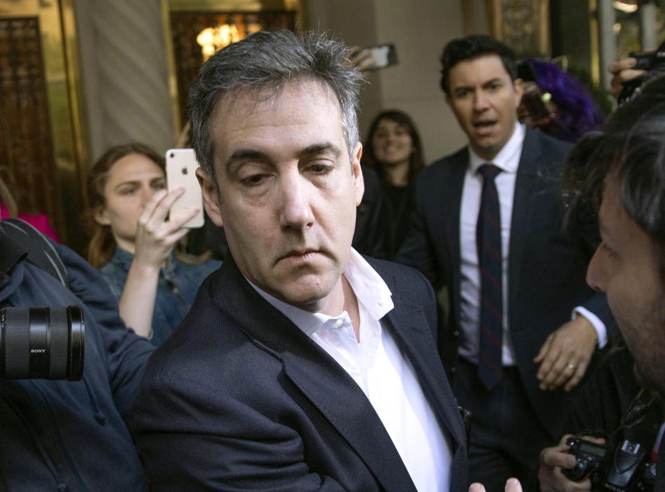 FILE - In this May 6, 2019, file photo, Michael Cohen, former attorney to President Donald Trump, leaves his apartment building before beginning his prison term in New York. Porn actress Stormy Daniels has agreed to dismiss a lawsuit that accused her former lawyer of colluding with Cohen to have her deny having an affair with Trump. A notice of agreement with Cohen and Daniels' ex-attorney, Keith Davidson, were filed Thursday, May 16, with a Los Angeles court. (AP Photo/Kevin Hagen, File)