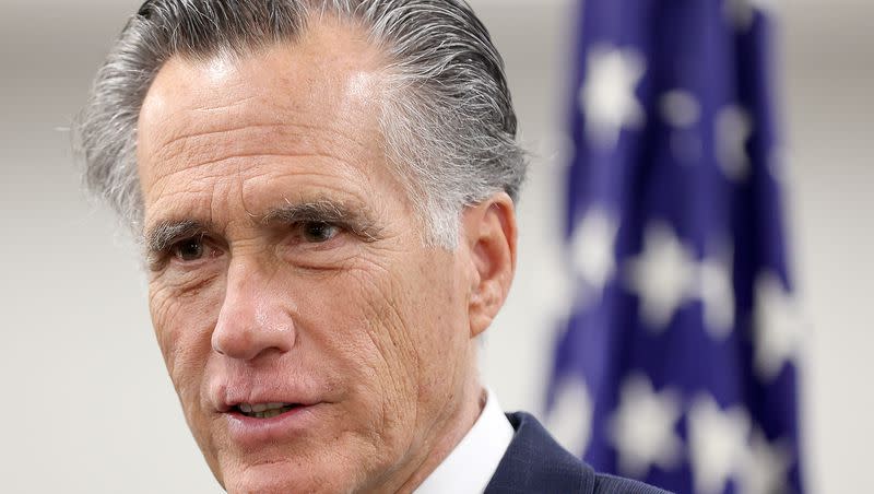 Sen. Mitt Romney, R-Utah, speaks to members of the media while visiting the State Department’s Salt Lake City Passport Fair at the Bennett Federal Building in Salt Lake City on Feb. 16, 2024.