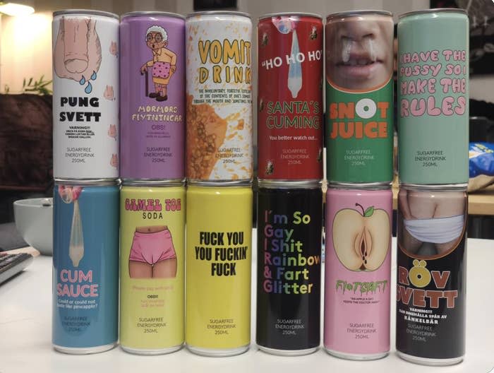 A display of 12 humorously branded beverage cans with labels featuring quirky and explicit phrases such as 'Vomit Drink,' 'Cum Sauce,' and 'I'm So Gay I Shit Rainbow & Fart Glitter.'