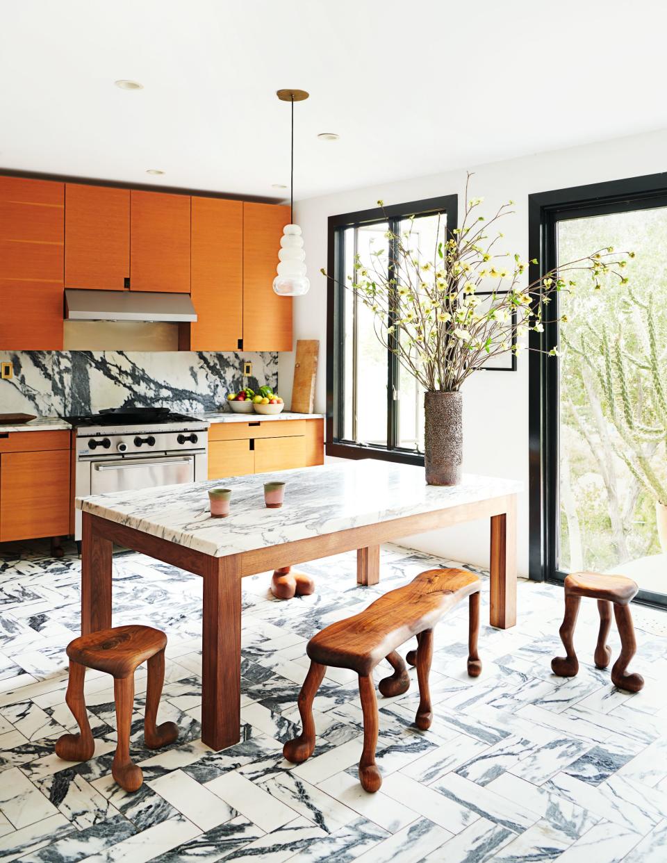 Shown is the marble-clad Los Angeles kitchen of Nikolai Haas and Djuna Bel.