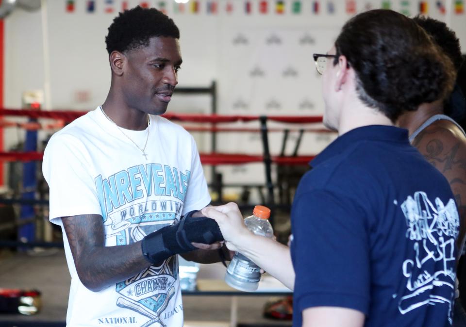 Dominique Crowder greets friends during a ceremony at APJ Boxing in Poughkeepsie Aug. 23, 2023. Crowder won the WBA bantamweight international title earlier this month and he was celebrated in a ceremony by the gym that first trained him.