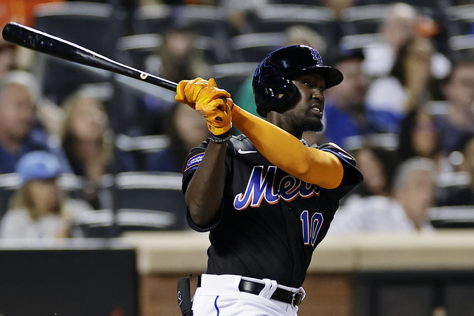 New York Mets' Ronny Mauricio watches his double against the Seattle Mariners, his first hit in the majors, during the third inning of a baseball game Friday, Sept. 1, 2023, in New York. (AP Photo/Adam Hunger)