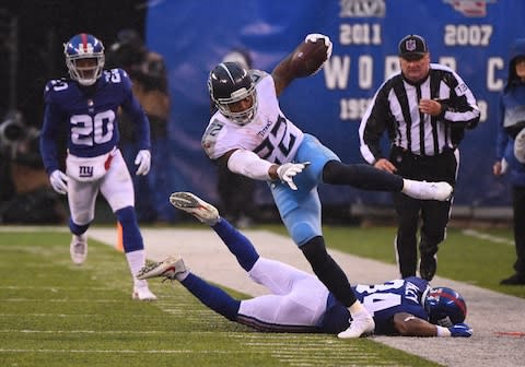 Tennessee Titans running back Derrick Henry (22) carries for a first down against the New York Giants during the 2nd quarter at MetLife Stadium - Credit: Robert Deutsch/USA TODAY