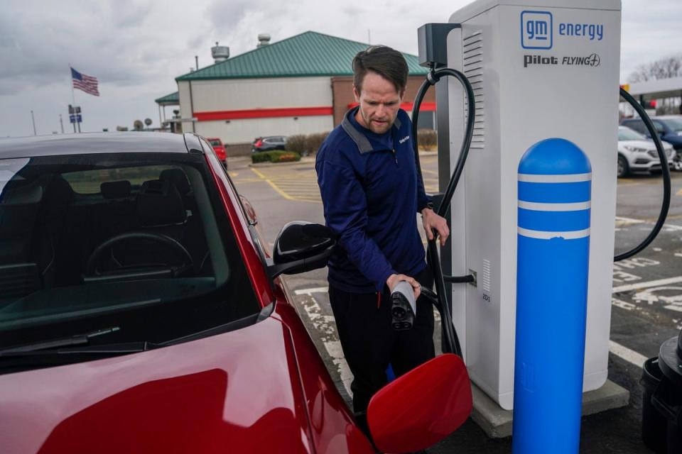 Liam Sawyer charges his Ford Mustang Mach-E, earlier this month at an electric vehicle charging station in London, Ohio. The charging ports are key to the US transition to EVs but the US government’s rollout has been slow (Copyright 2024 The Associated Press. All rights reserved)