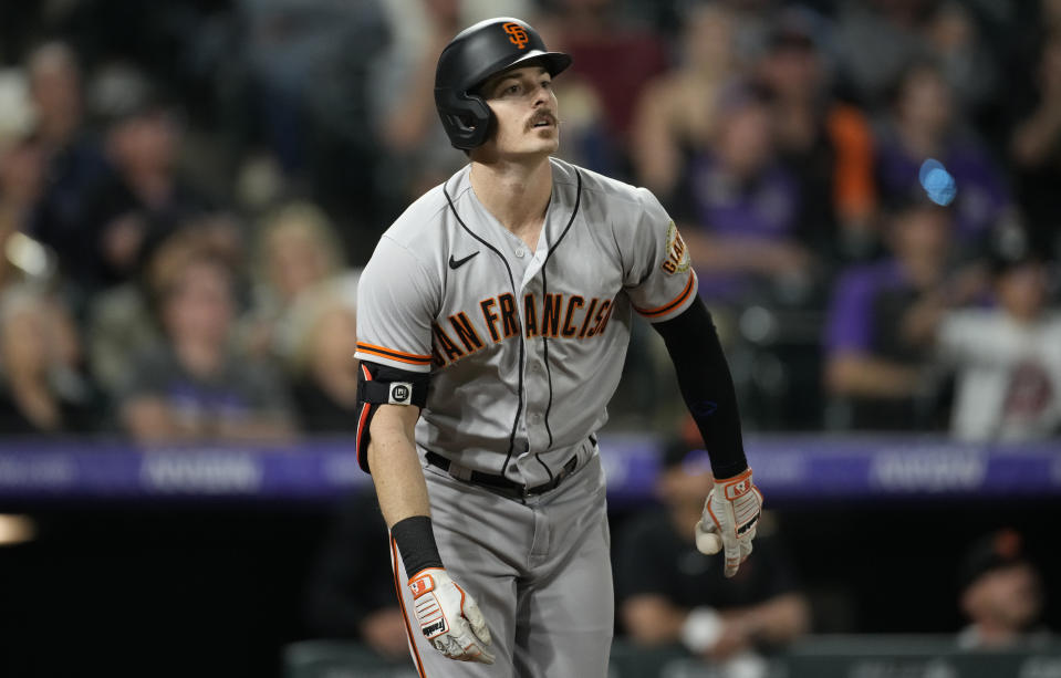 San Francisco Giants' Mike Yastrzemski heads up the first-base line after hitting a solo home run off Colorado Rockies relief pitcher Daniel Bard in the ninth inning of a baseball game Monday, May 16, 2022, in Denver. (AP Photo/David Zalubowski)