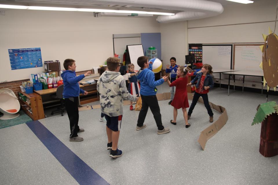 Alexander Elementary School students play "Hop the Ball" — a musical chairs style of game where the person holding the ball when the music stops was out — Nov. 11, 2022, at the Animal Kingdom of Kindness fall festival at the school.