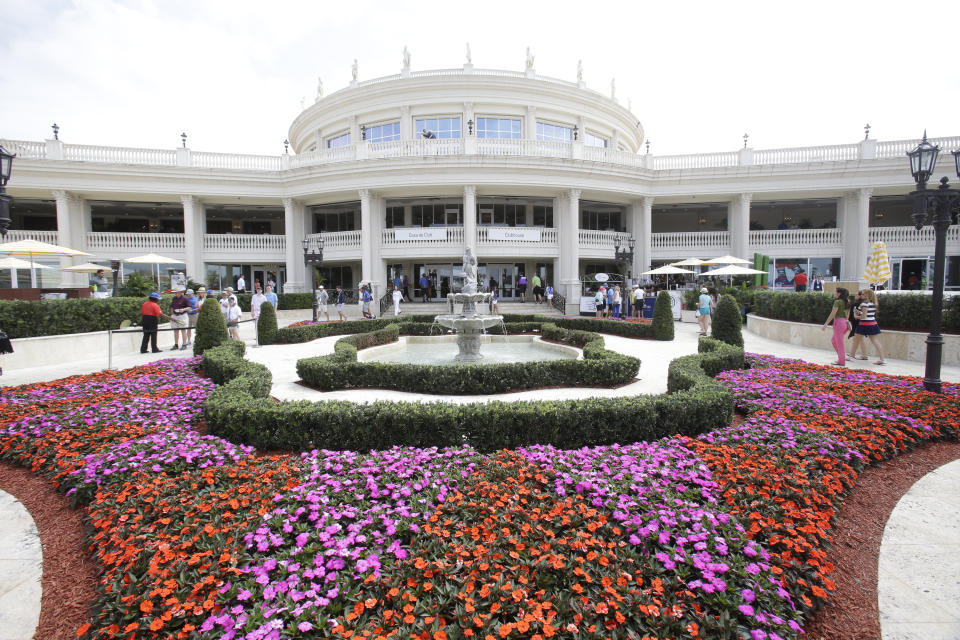 FILE - In this March 7, 2015, file photo, the Trump National Doral clubhouse is seen in Doral, Fla. President Donald Trump was in full sales mode Monday, Aug. 26, 2019, doing everything but passing out brochures as he touted the features that would make the Doral golf resort the ideal place for the next G7 Summit _ close to the airport, plenty of hotel rooms, separate buildings for every delegation, even top facilities for the media. (AP Photo/Wilfredo Lee, File)