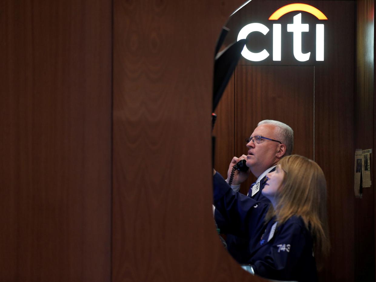 FILE PHOTO: Traders work in the Citigroup booth on the floor of the New York Stock Exchange (NYSE) in New York City, U.S., May 25, 2016.  REUTERS/Brendan McDermid/File Photo