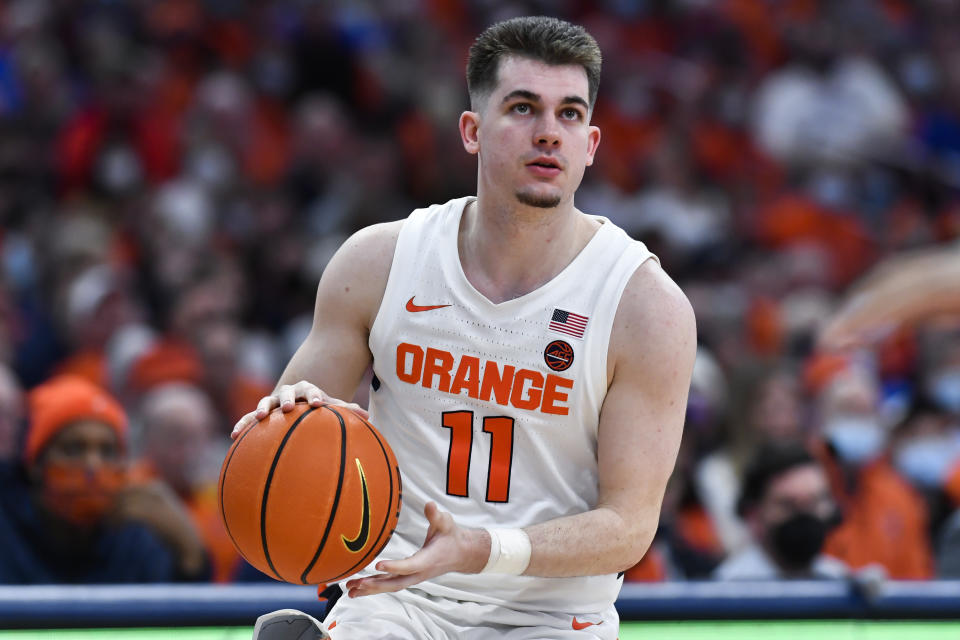 FILE - Syracuse guard Joseph Girard III (11) prepares to shoot during the second half of an NCAA college basketball game against Duke in Syracuse, N.Y., Saturday, Feb. 26, 2022. Girard is one of two starters back for another season. (AP Photo/Adrian Kraus, FILE)