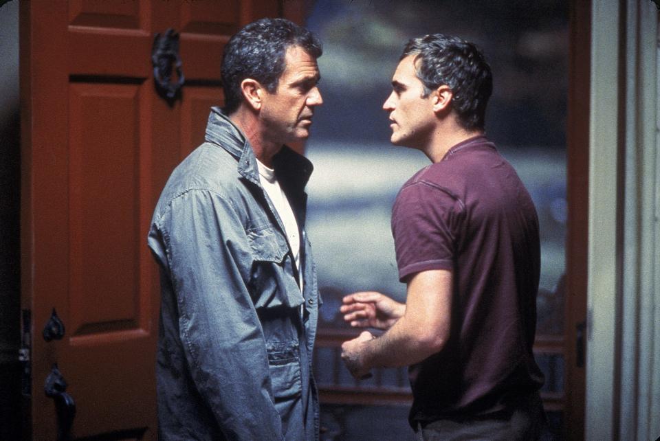 Mel GIbson (left) and Joaquin Phoenix are farm dudes dealing with an alien invasion in "Signs."